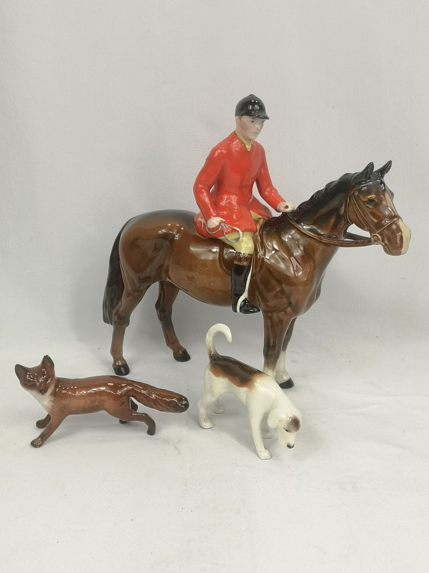 Beswick huntsman together with a Beswick fox and hound