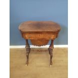 Walnut games table with work basket below.