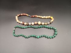 Malachite necklace together with an onyx necklace