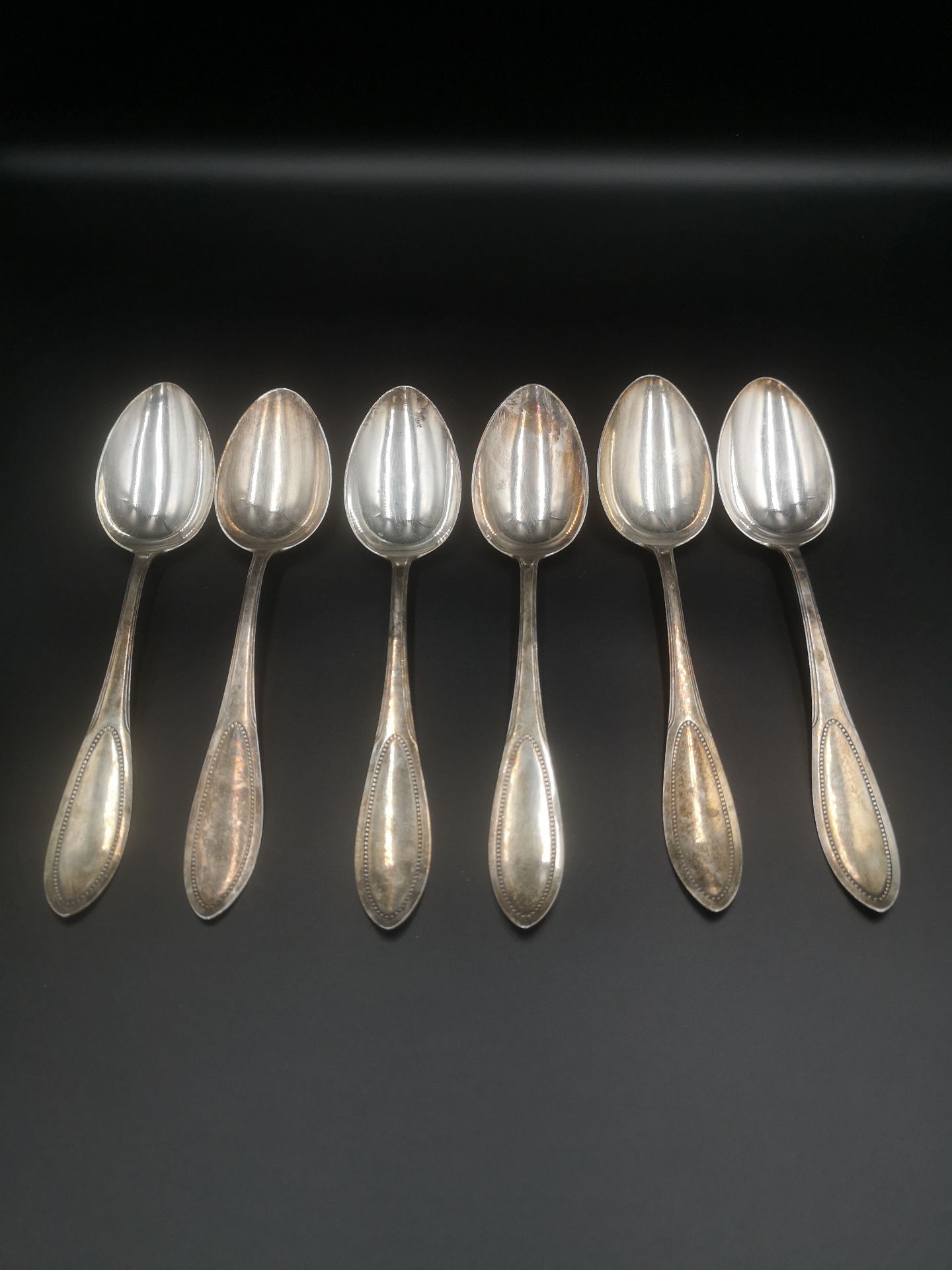 Six silver dessert spoons