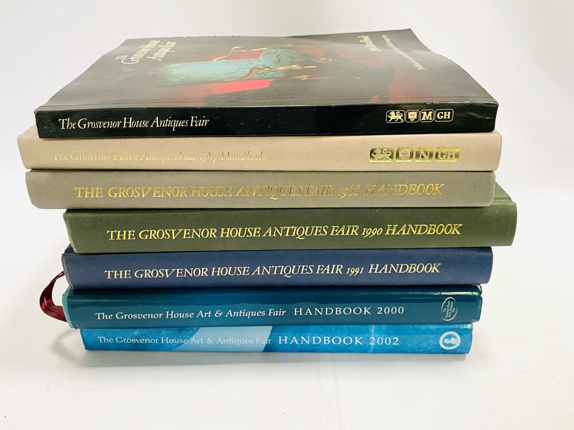 Seven volumes of the Grosvenor House Antique Fair Handbook