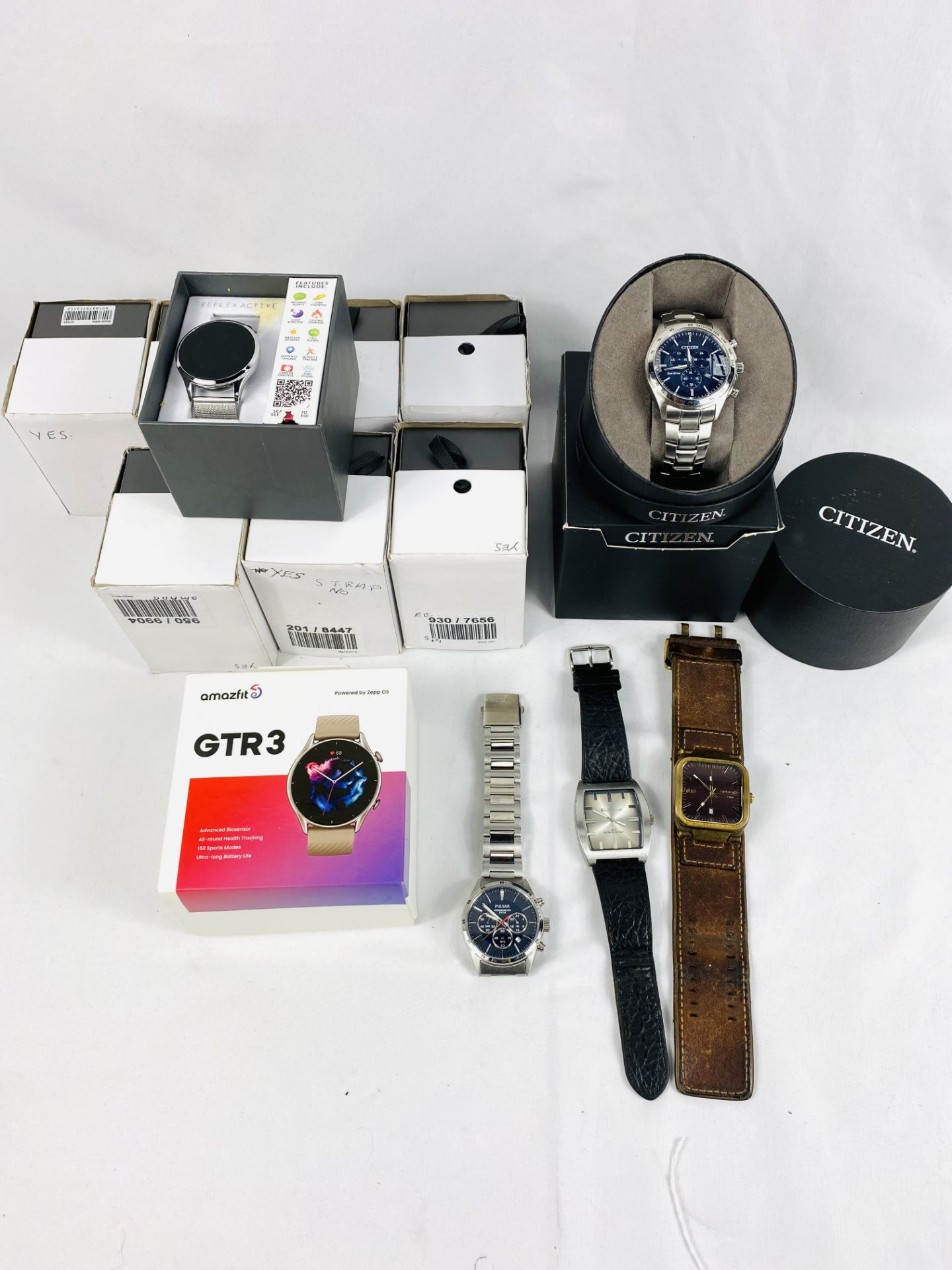 Boxed Citizen watch, three fashion watches and nine smart watches