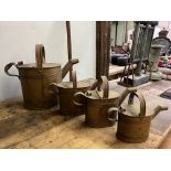 Set of 4 graduated brass cans. This lot carries VAT.