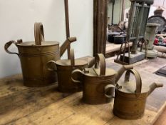 Set of 4 graduated brass cans. This lot carries VAT.