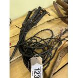 5 black plaited leather bull whips. This lot carries VAT.