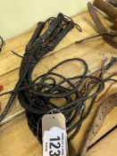 5 black plaited leather bull whips. This lot carries VAT.