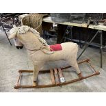 Fabric covered rocking horse. This lot carries VAT.