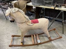 Fabric covered rocking horse. This lot carries VAT.
