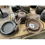 Five griddle pans, a saucepan, and 3 frying pans