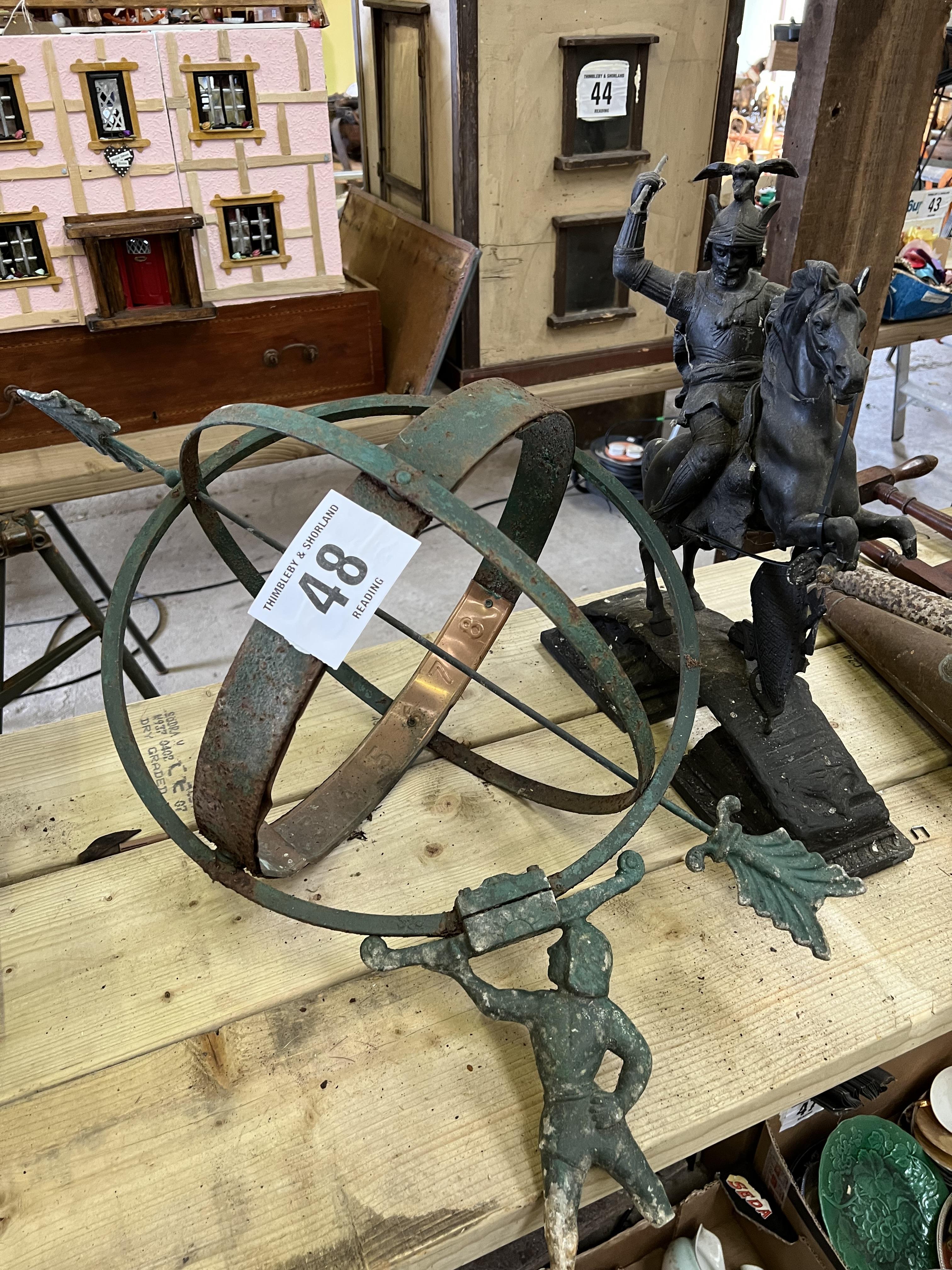 An armillary/sundial and a metal figure of a warrior on horseback. This lot carries VAT.