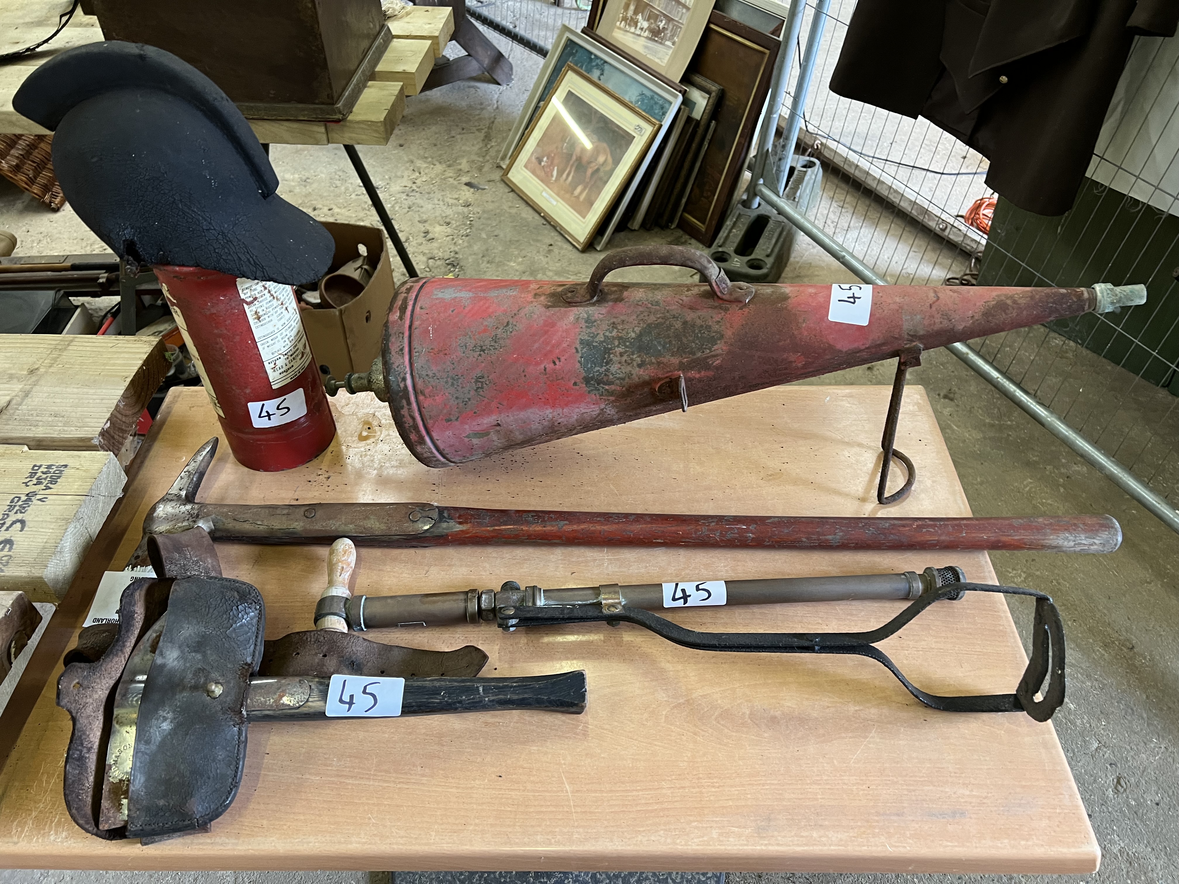 Qty antique fire fighting equipment. This lot carries VAT.