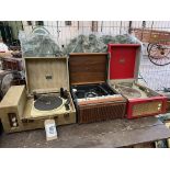 Three portable record players. This lot carries VAT.