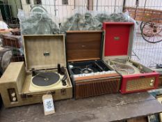 Three portable record players. This lot carries VAT.