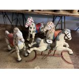 Four child's toy horses