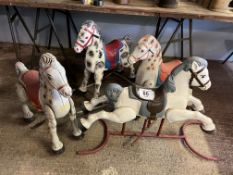 Four child's toy horses