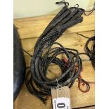 5 black plaited leather bull whips. This lot carries VAT.