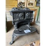 Cast iron Queenie-type stove. This lot carries VAT.