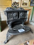 Cast iron Queenie-type stove. This lot carries VAT.