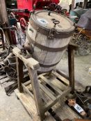 Wooden butter churn on wooden stand