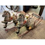 A pair of child's tin rocking horses