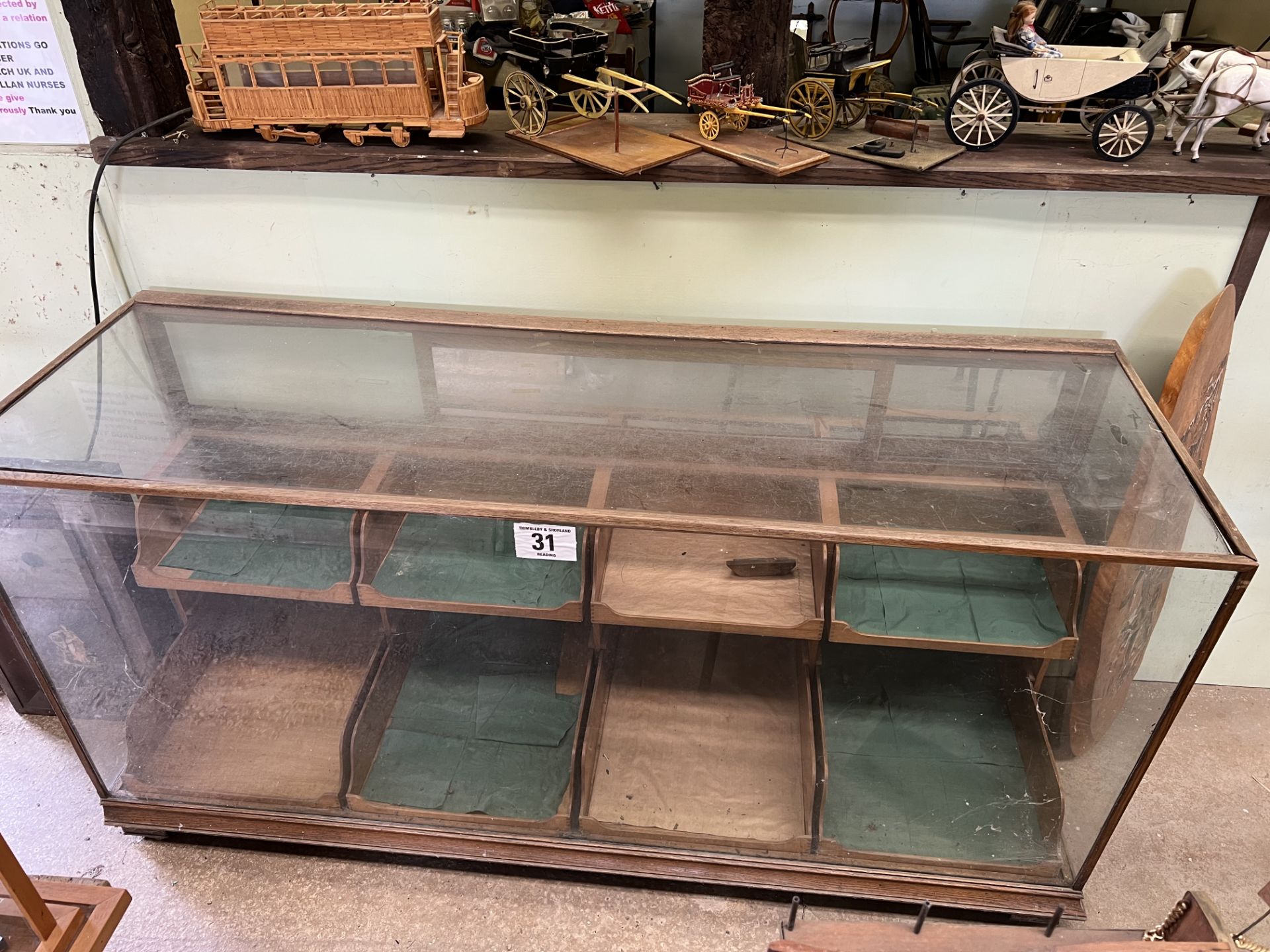 Glass shop display cabinet with drawers. This lot carries VAT.