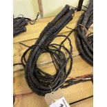 5 black plaited leather bull whips. This lot carries VAT.