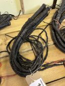 5 black plaited leather bull whips. This lot carries VAT.