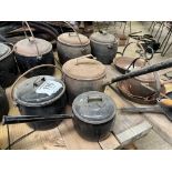 Two enamel lidded pots and a cast iron lidded saucepan