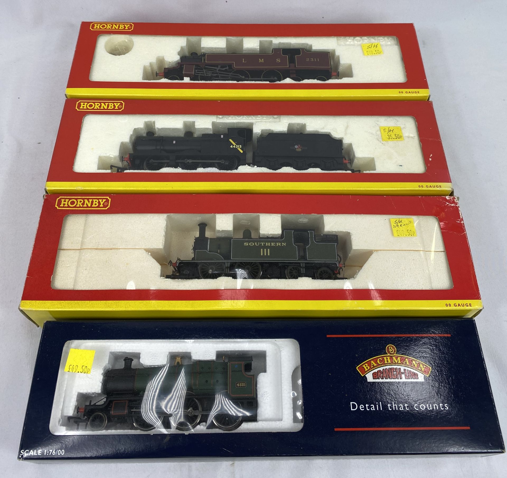 Three Hornby 00 gauge locomotive; together with a Bachmann 00 gauge locomotive.