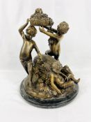 Large bronze figural set of three Bacchanalian nude boys on marble base