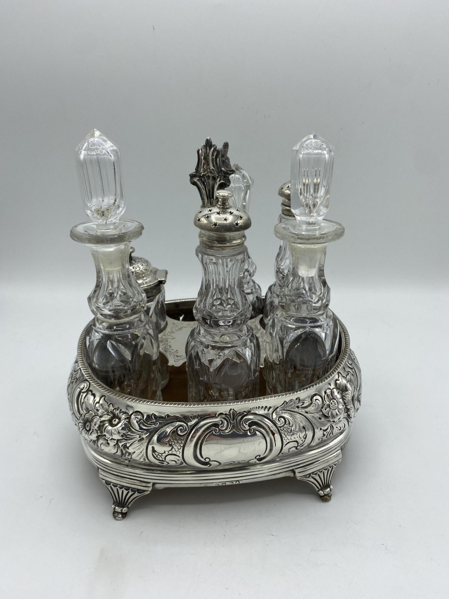 Silver mounted cruet frame, together with six cut glass cruet bottles