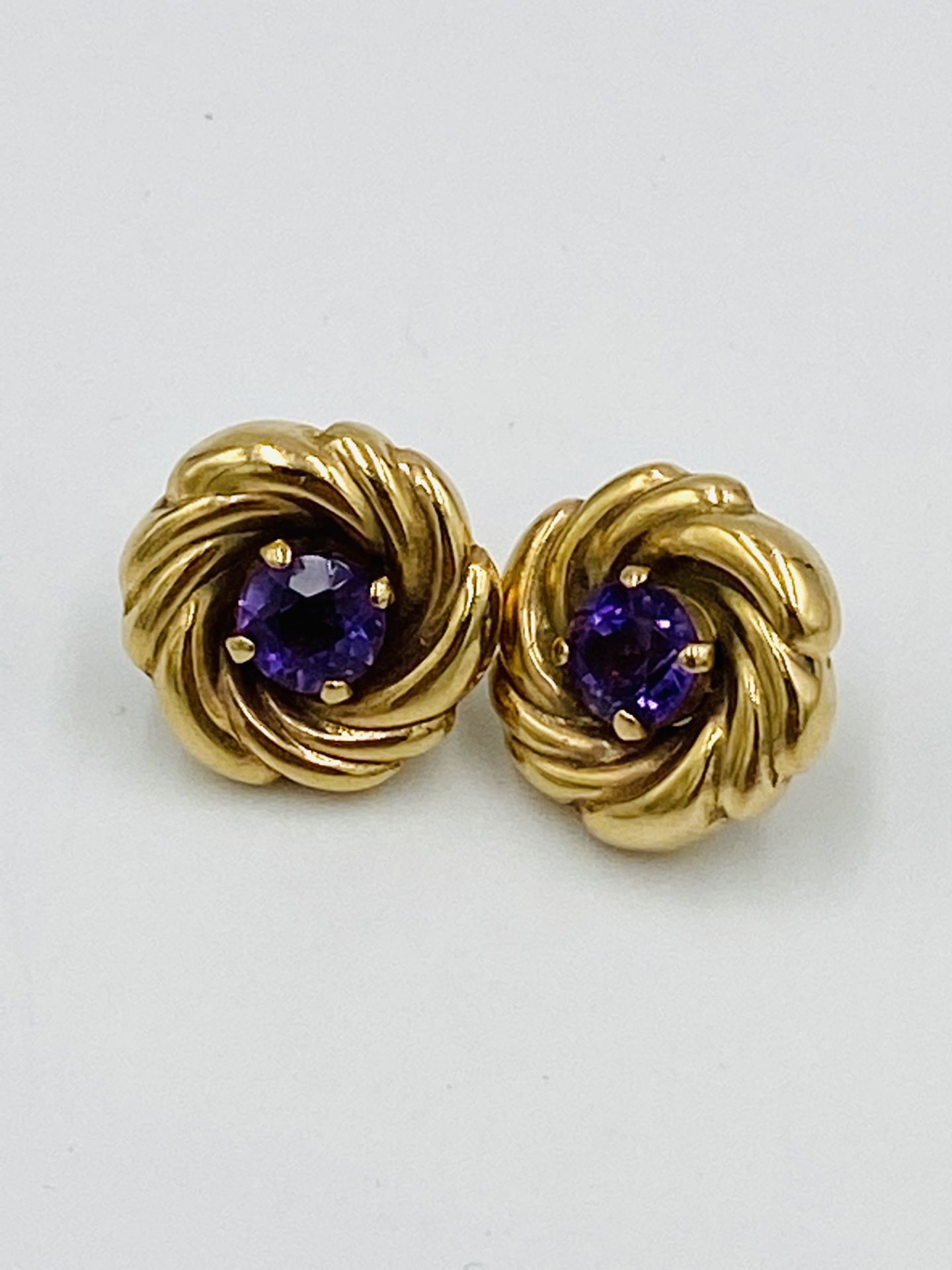 A pair of 9ct gold and amethyst circular 'whirl' earrings - Image 4 of 4