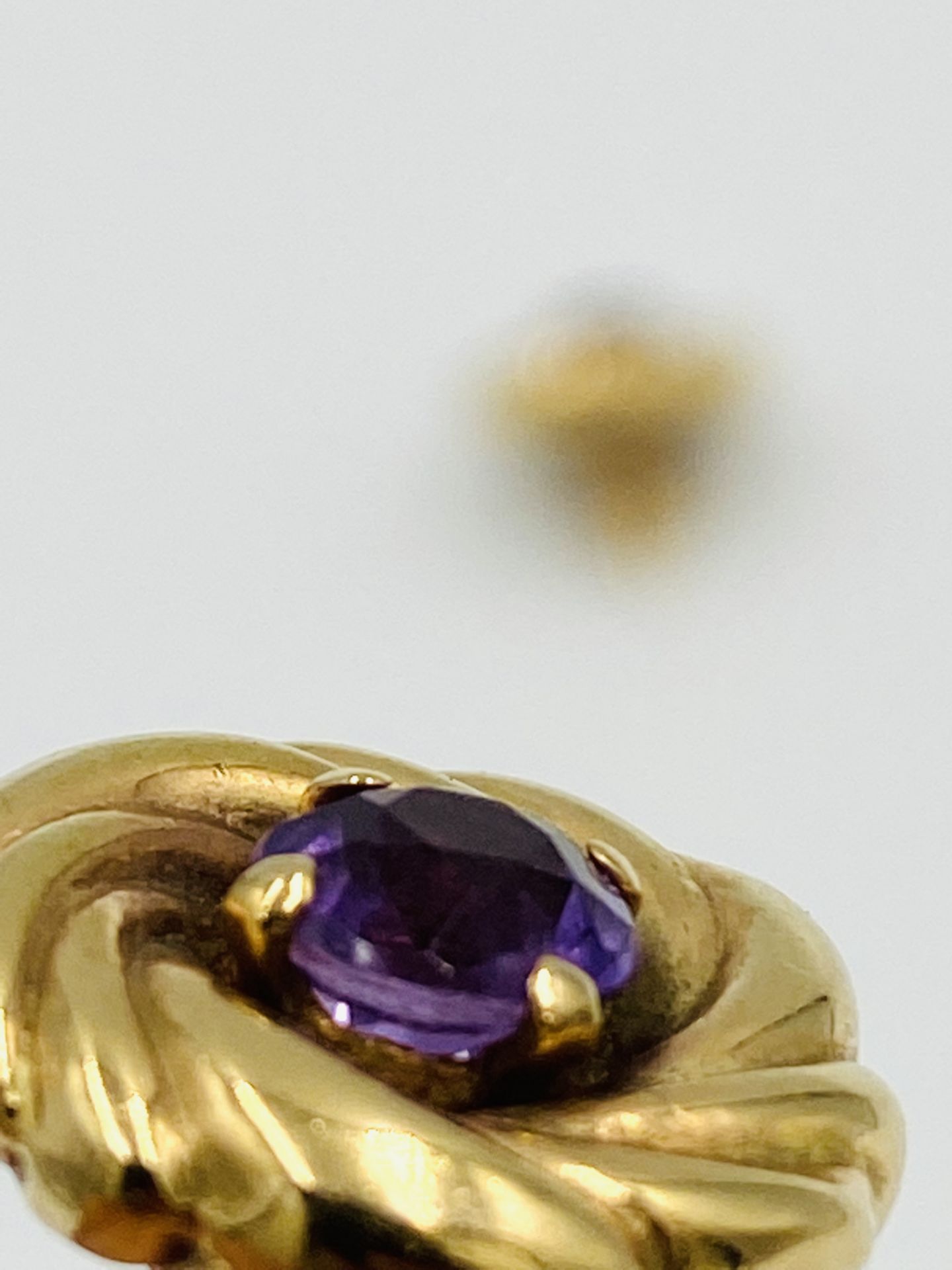 A pair of 9ct gold and amethyst circular 'whirl' earrings - Image 3 of 4