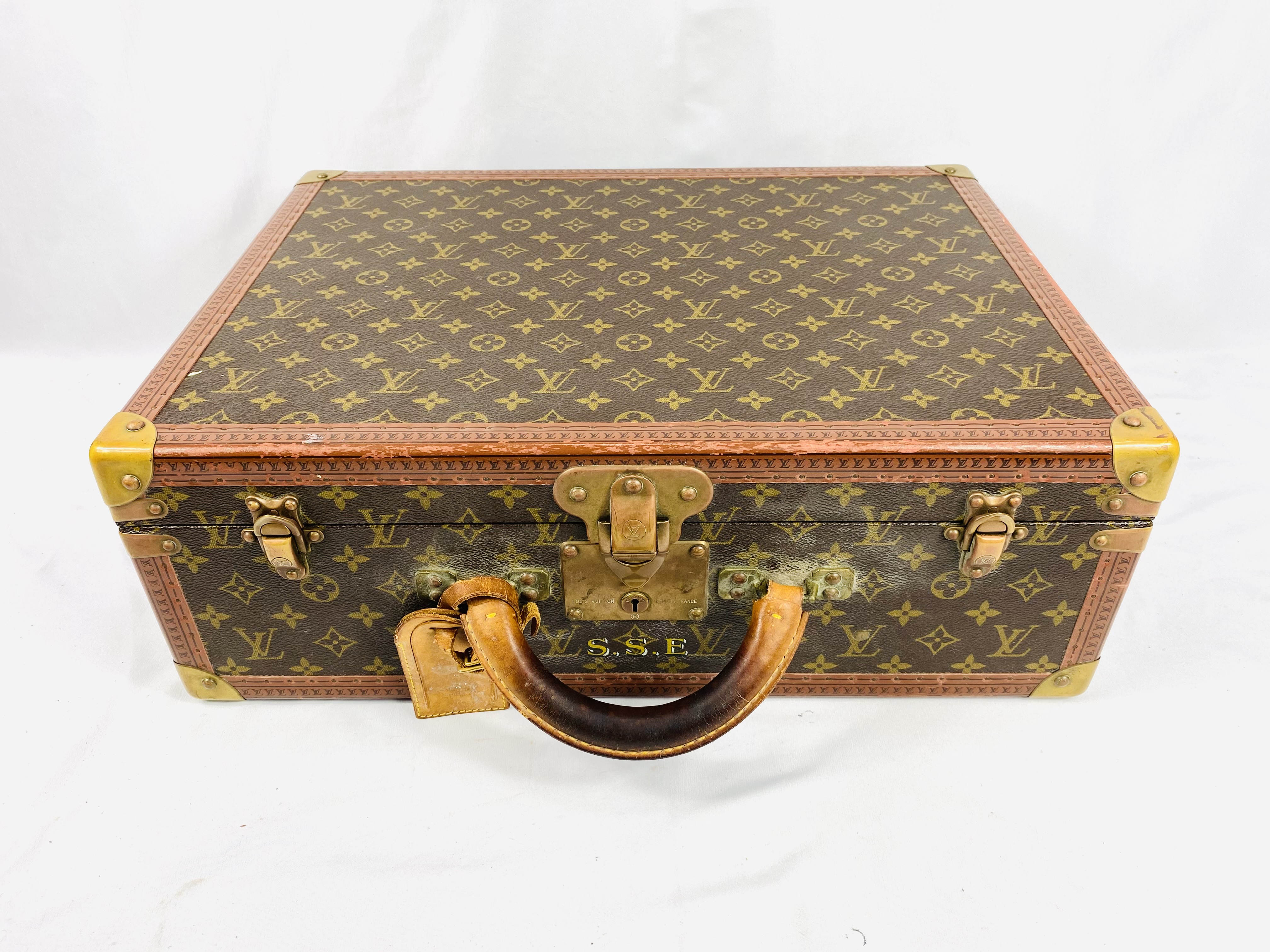 Louis Vuitton suitcase with protective cover