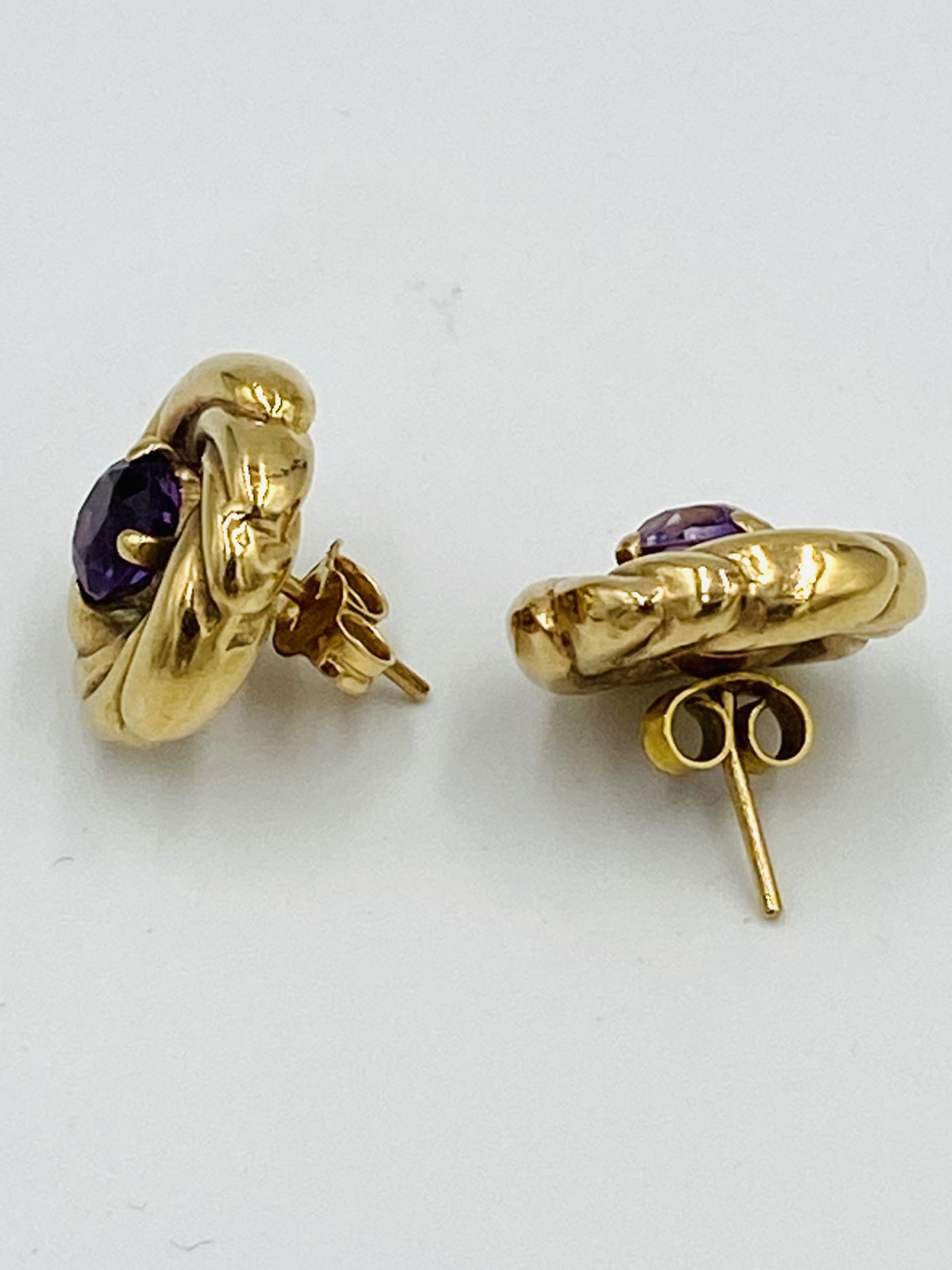 A pair of 9ct gold and amethyst circular 'whirl' earrings - Image 2 of 4