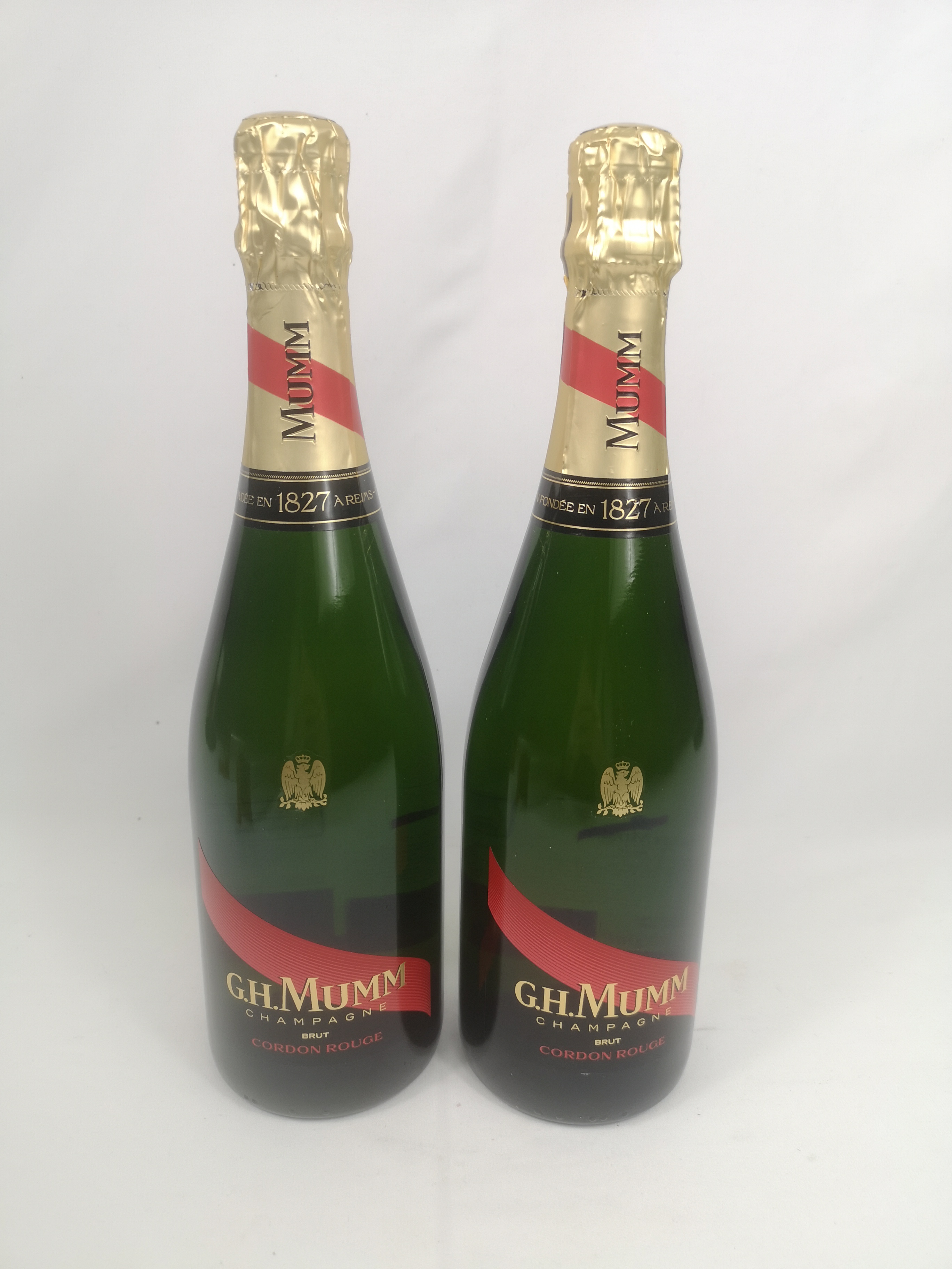 Two 75cl bottles of G.H. Mumm Brut Cordon Rouge champagne in boxes.