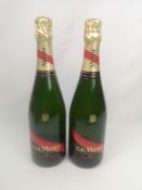 Two 75cl bottles of G.H. Mumm Brut Cordon Rouge champagne in boxes.
