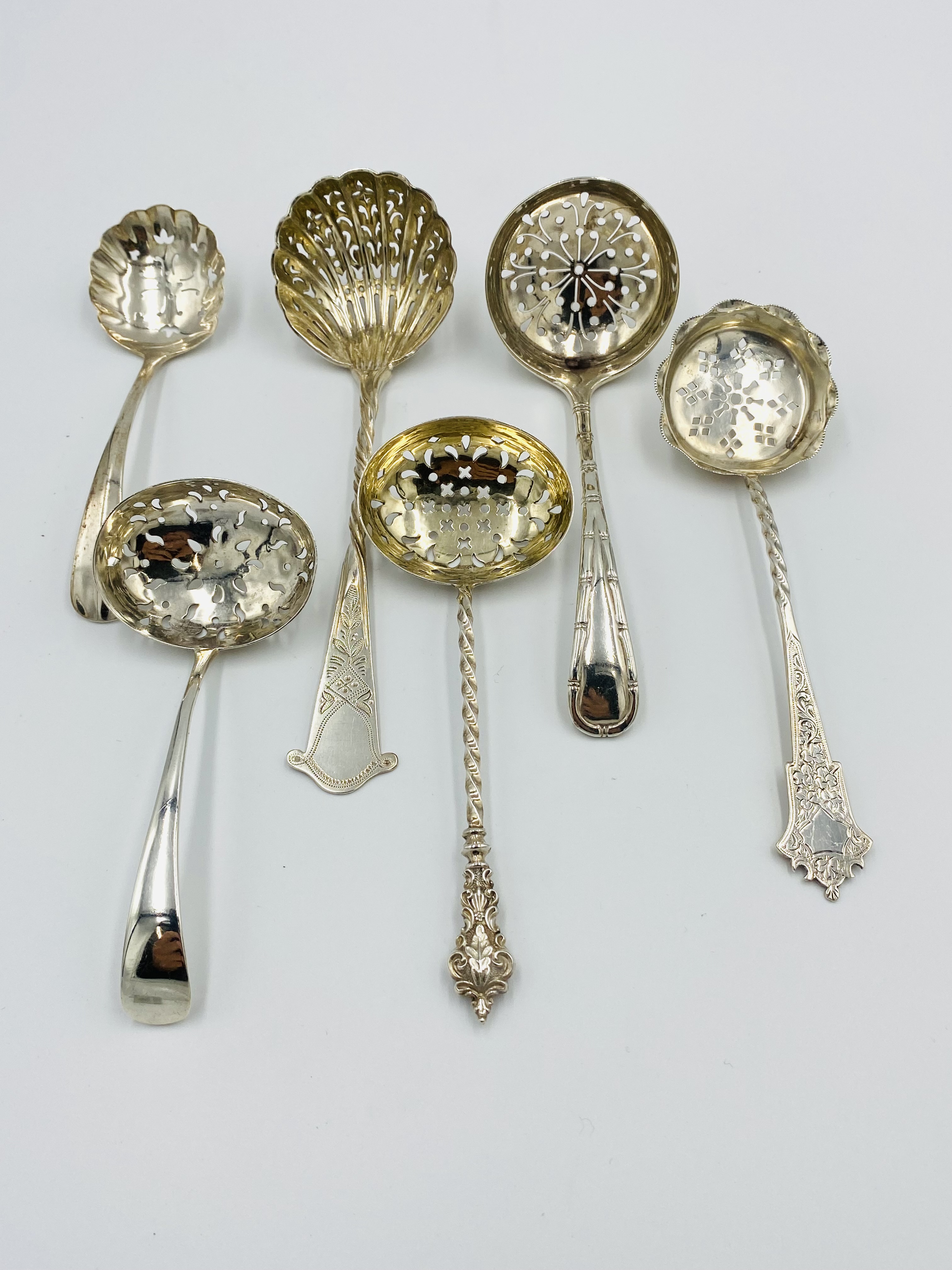 Six silver sugar sifters