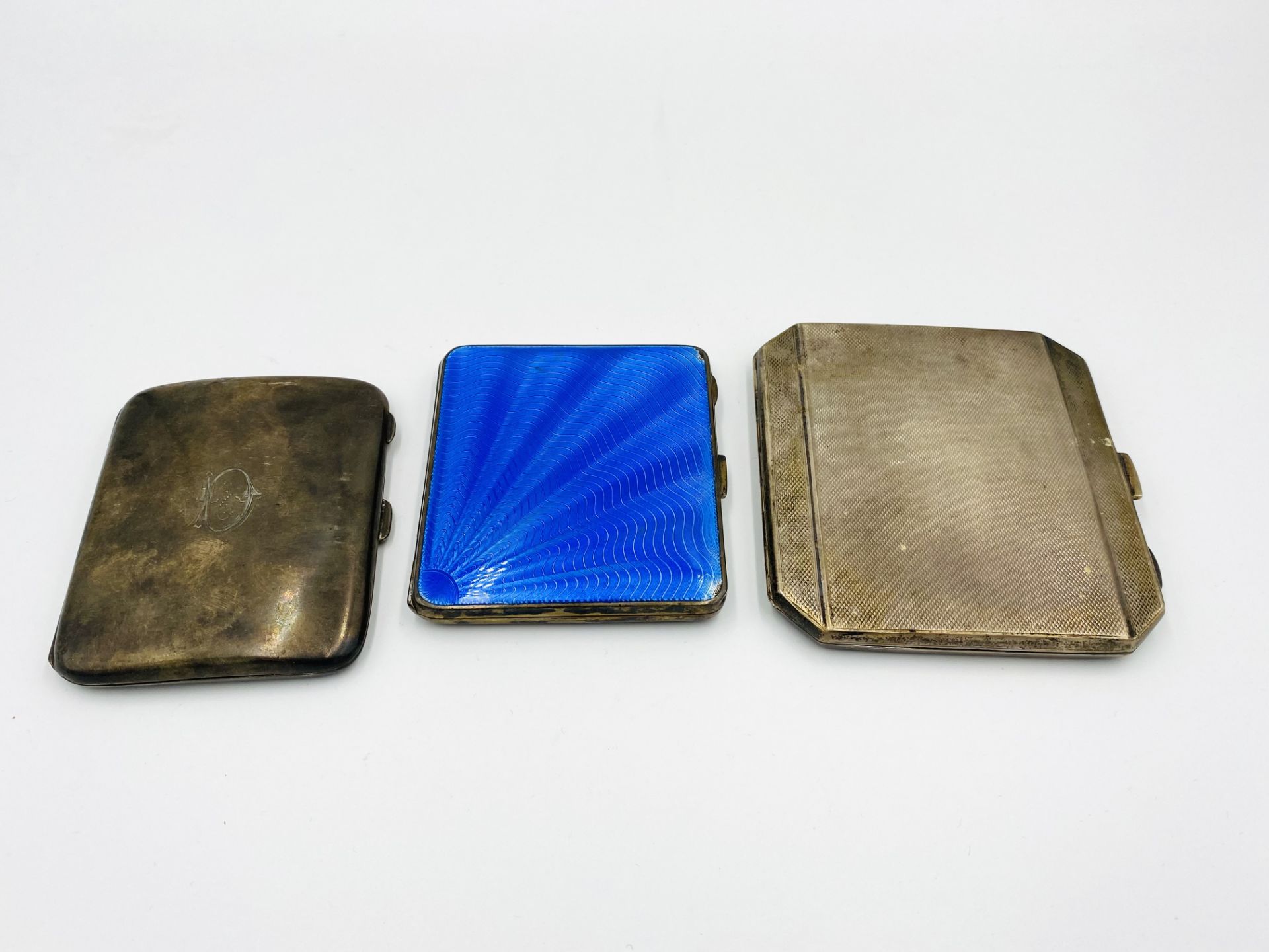 Three silver cigarette cases together with a brass cigarette case - Image 2 of 5
