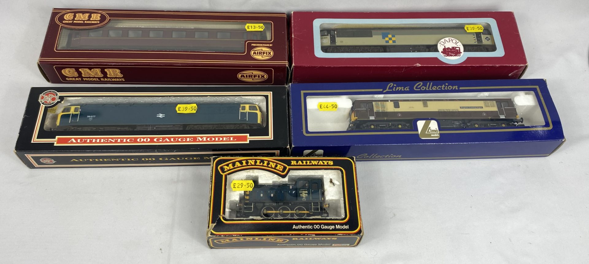 Three boxed 00 gauge diesel locomotives and other items
