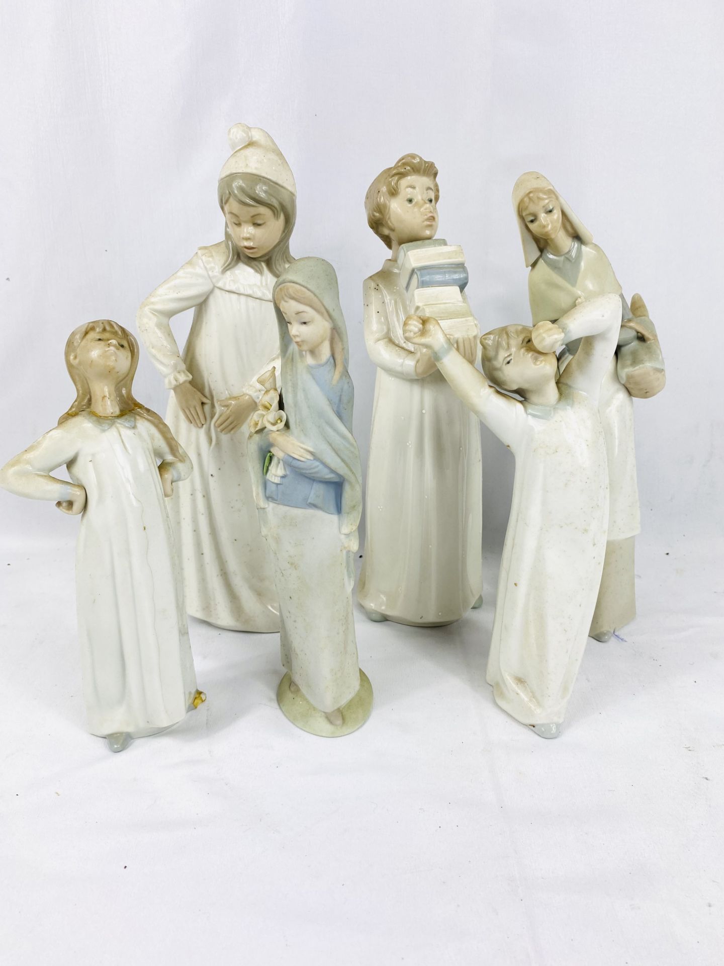 Six Lladro and Nao figurines