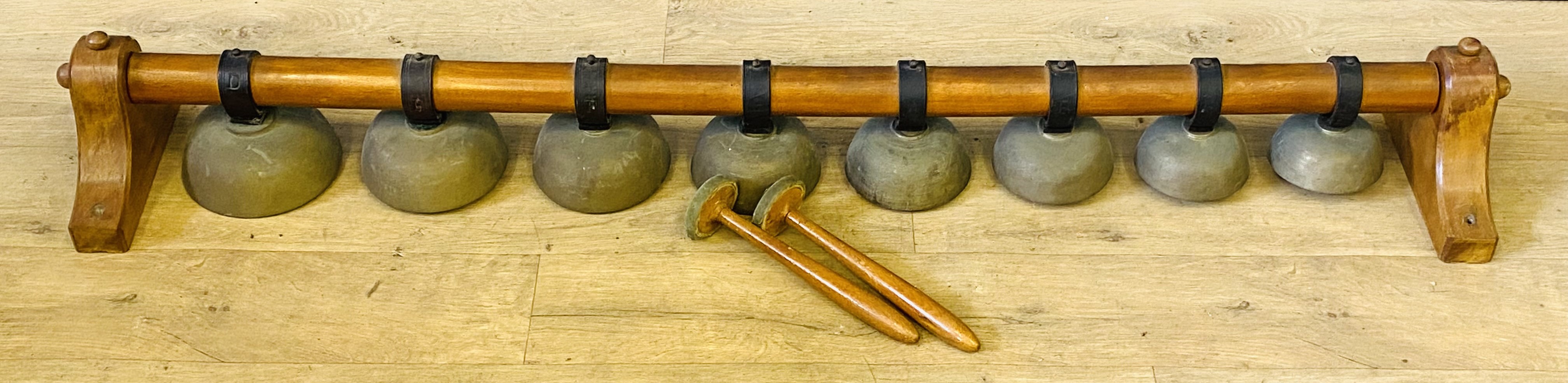 Set of eight campinology brass bells