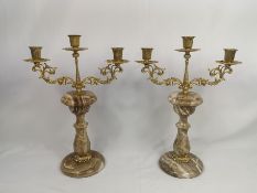 Pair of gilt metal candelabras on onyx bases