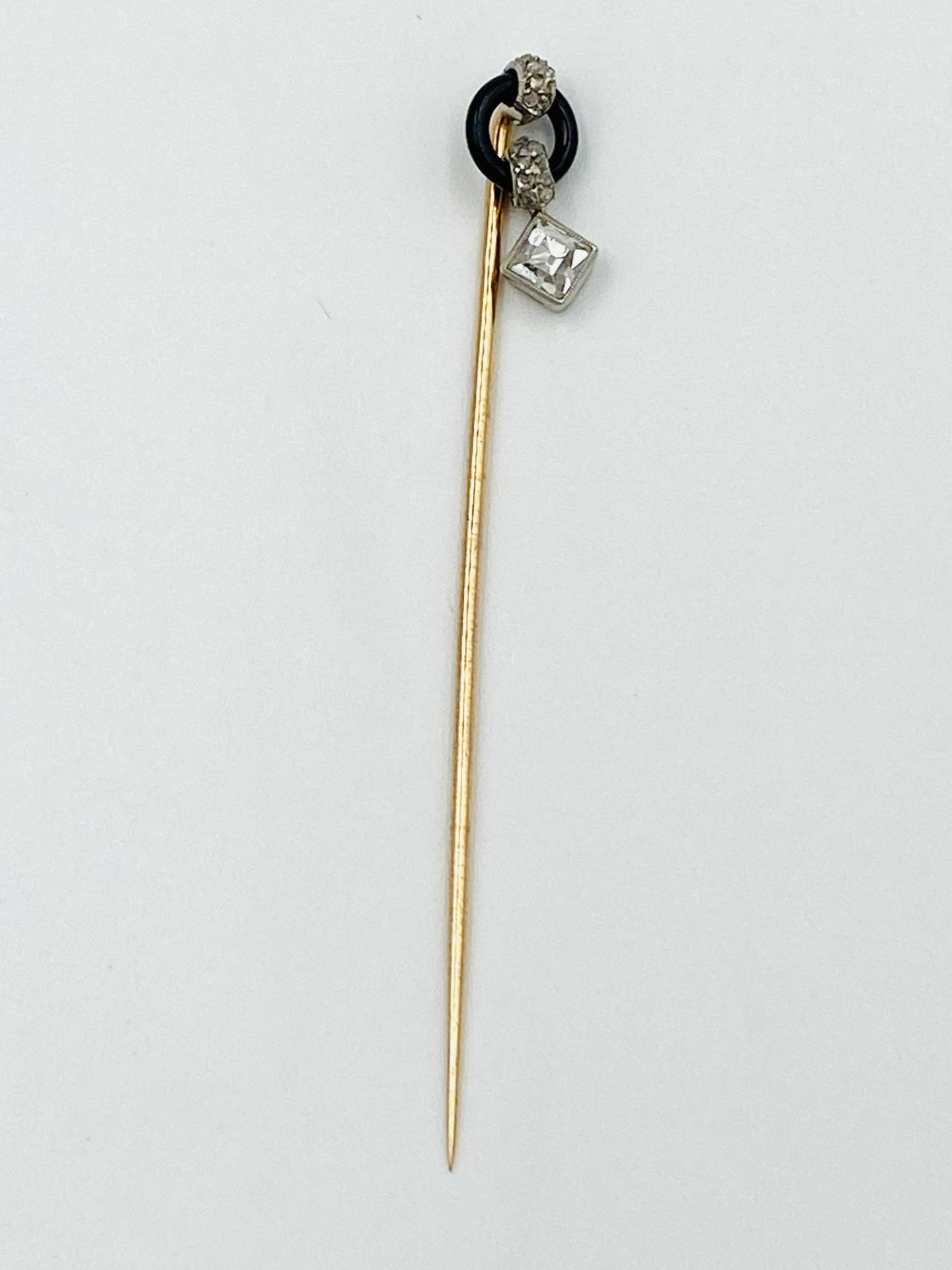 Cartier Paris, gold, onyx and diamond stick pin