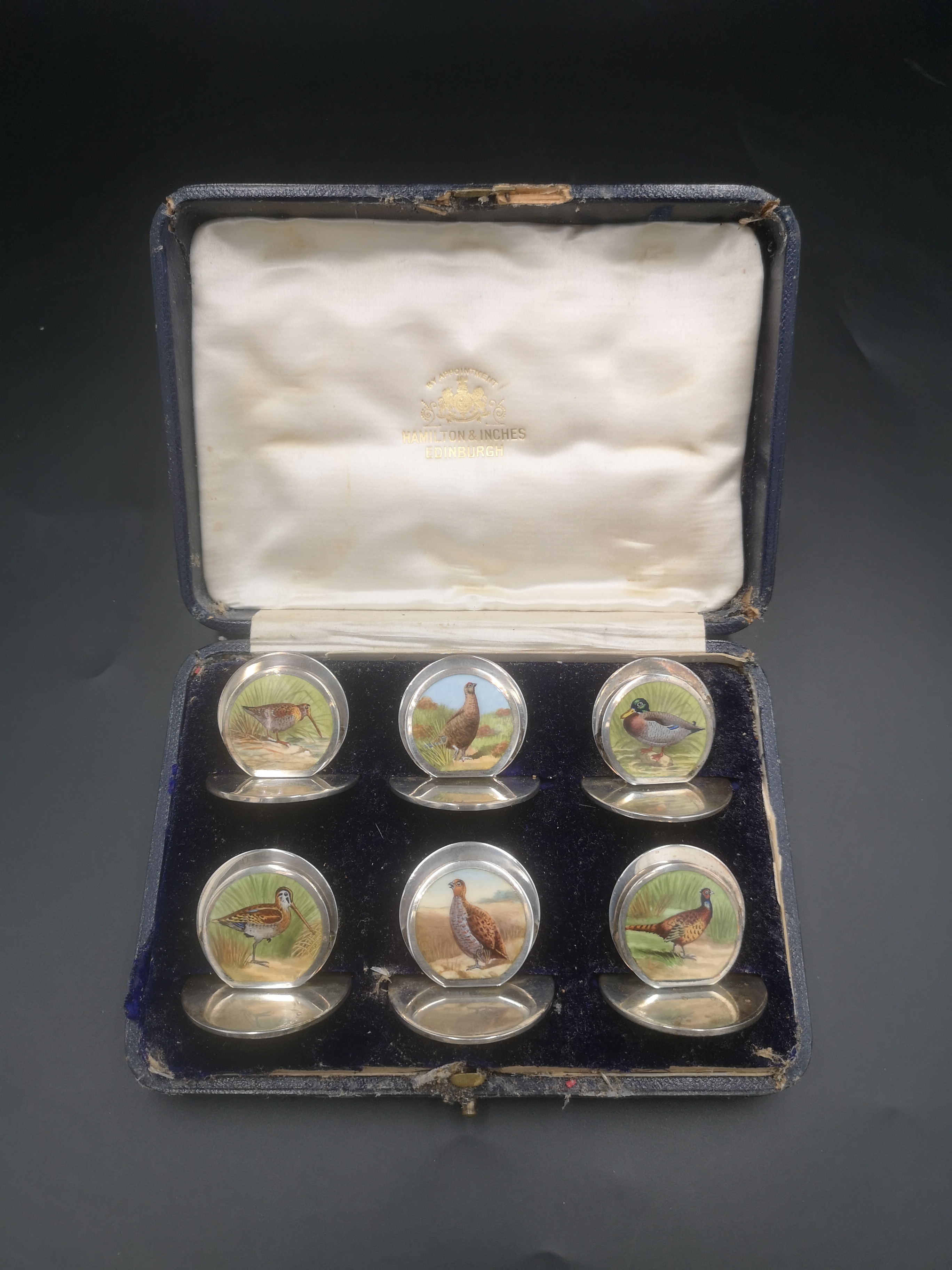 Boxed set of Edwardian silver menu card holders with hand painted birds by Sampson Mordan