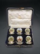 Boxed set of Edwardian silver menu card holders with hand painted birds by Sampson Mordan