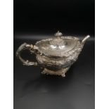 Silver teapot with repousse decoration