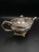 Silver teapot with repousse decoration