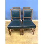 Four carved oak dining chairs