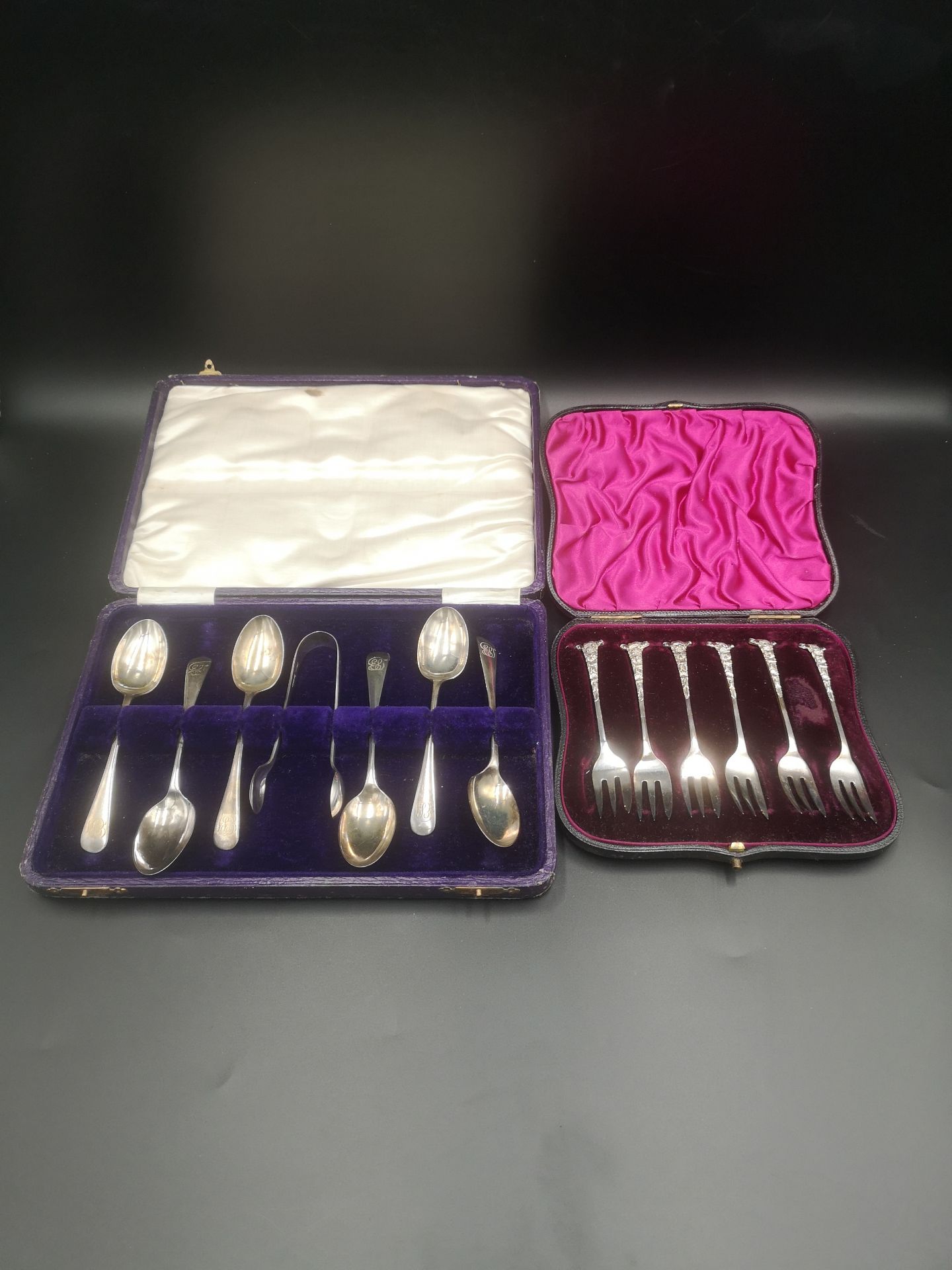 Boxed set of six silver tea spoons together with a boxed set of silver forks